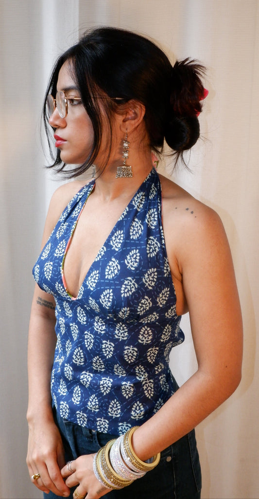 Backless GEET halter neck top in pure cotton with a playful electric blossom print.