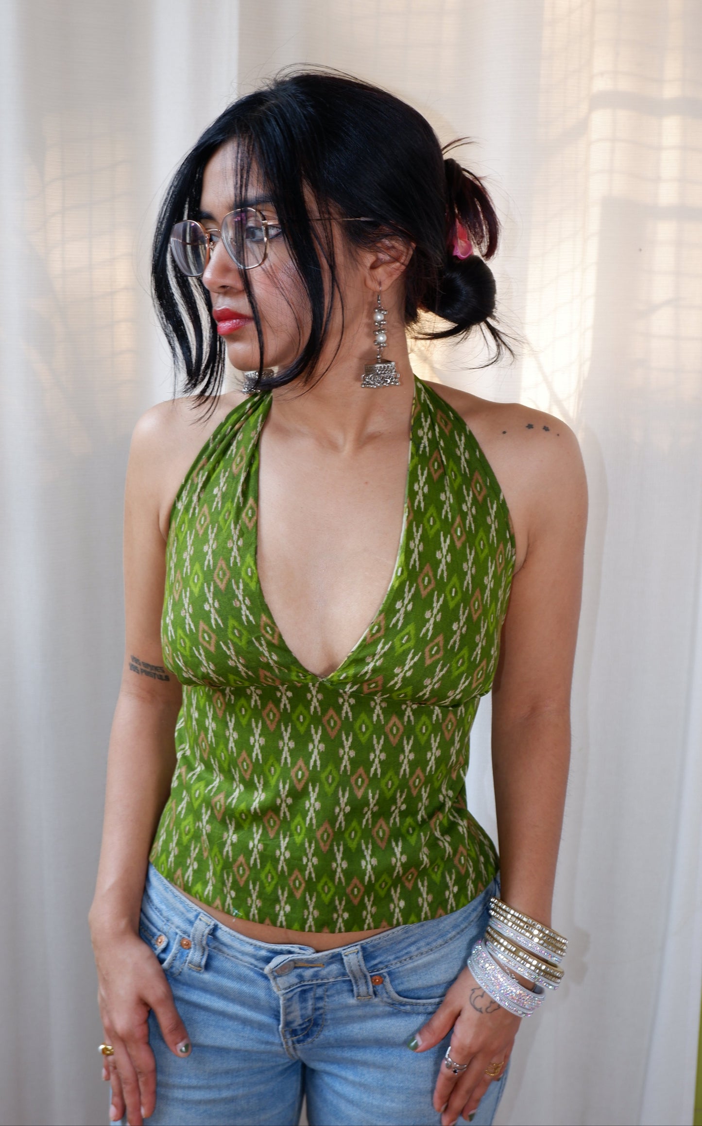 Backless GEET halter neck top in pure cotton with a playful green muse print.