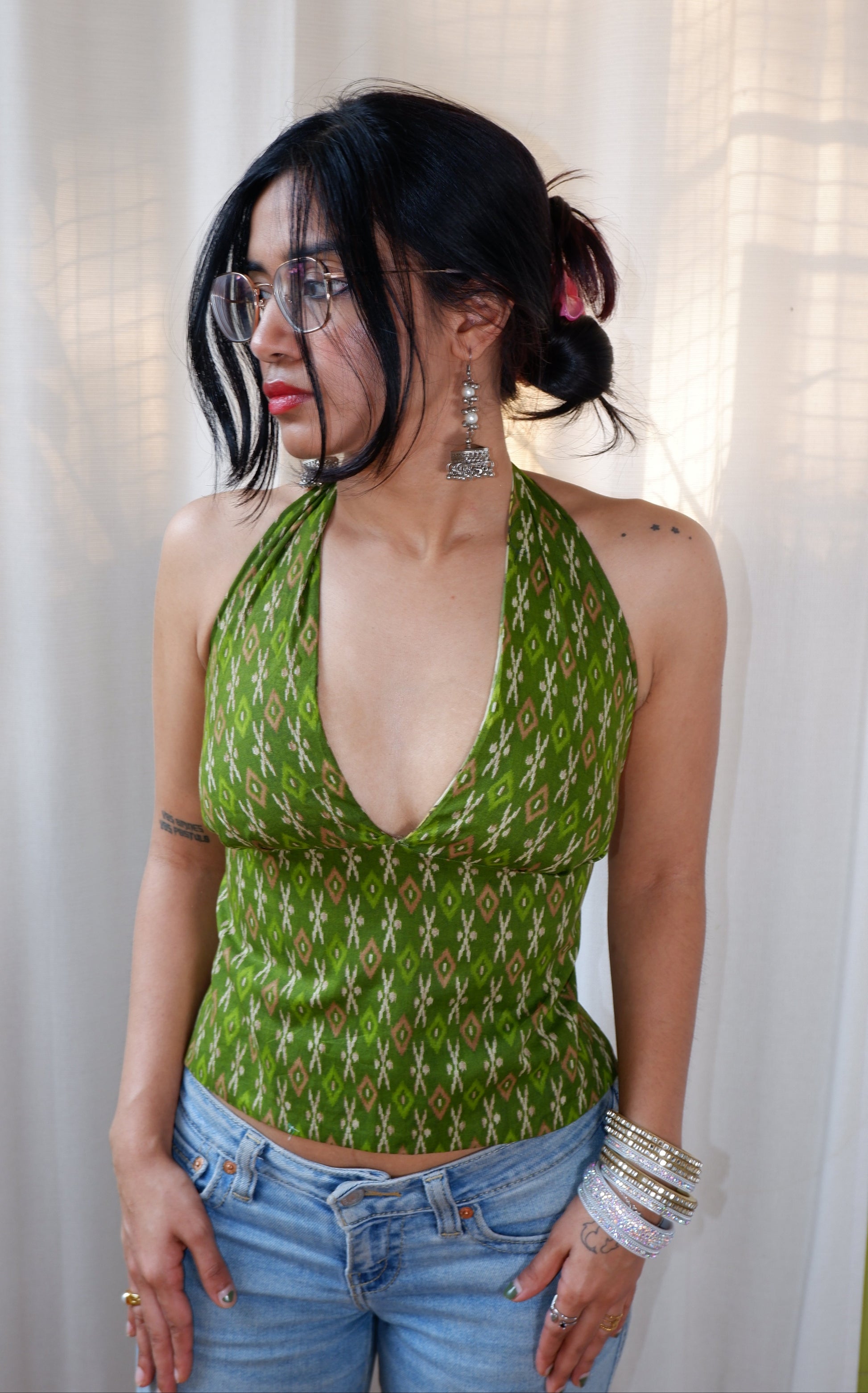 Backless GEET halter neck top in pure cotton with a playful green muse print.