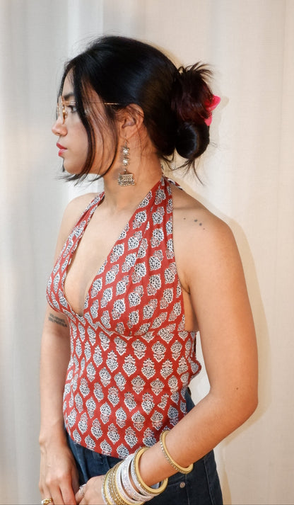 Backless GEET halter neck top in pure cotton with a playful terracotta print.