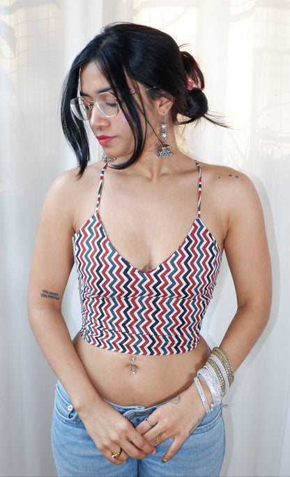 Backless GEET halter neck top in pure cotton with a playful terracotta print.